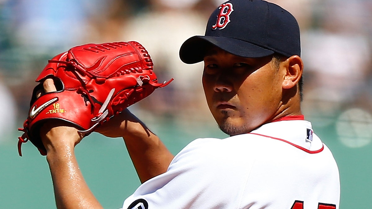 Daisuke Matsuzaka #18 of the Boston Red Sox pitches against the Kansas City Royals during the game on August 27, 2012 at Fenway Park in Boston, Massachusetts. (Photo by Jared Wickerham/Getty Images)