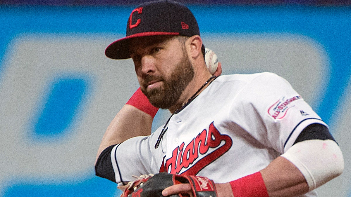 Cleveland Indians' Jason Kipnis throws out Seattle Mariners' Domingo Santana during the sixth inning of a baseball game in Cleveland, Friday, May 3, 2019. (AP Photo/Phil Long)