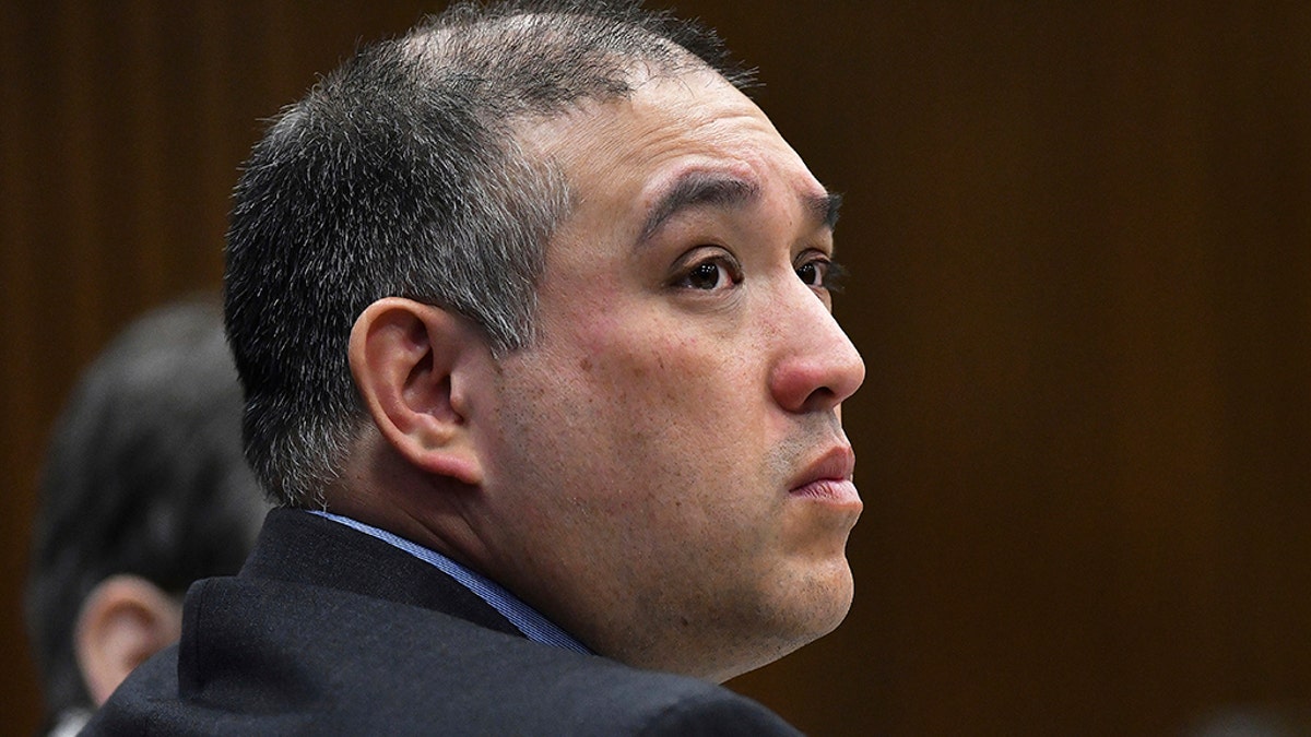 In this April 10, 2019, file photo, former Michigan state Trooper Mark Bessner listens to Assistant Wayne County Prosecutor Matthew Penney deliver his opening statement in Bessner's trial, in Detroit. (Clarence Tabb Jr./Detroit News via AP, File)