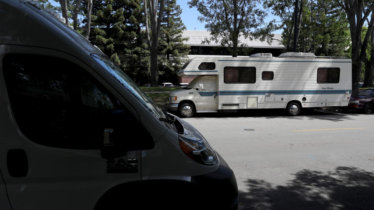 RVs parked on a street across from Google headquarters in Mountain View, California on May 22, 2019.