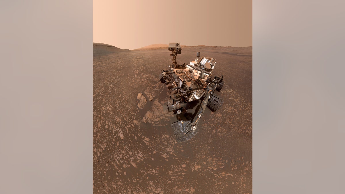 NASA's Curiosity Mars Rover Finds a Clay Cache NASA's Curiosity Mars rover took this selfie on May 12, 2019 (the 2,405th Martian day, or sol, of the mission). To the lower-left of the rover are its two recent drill holes, at targets called "Aberlady" and "Kilmarie." (Credit: NASA/JPL-Caltech/MSSS)