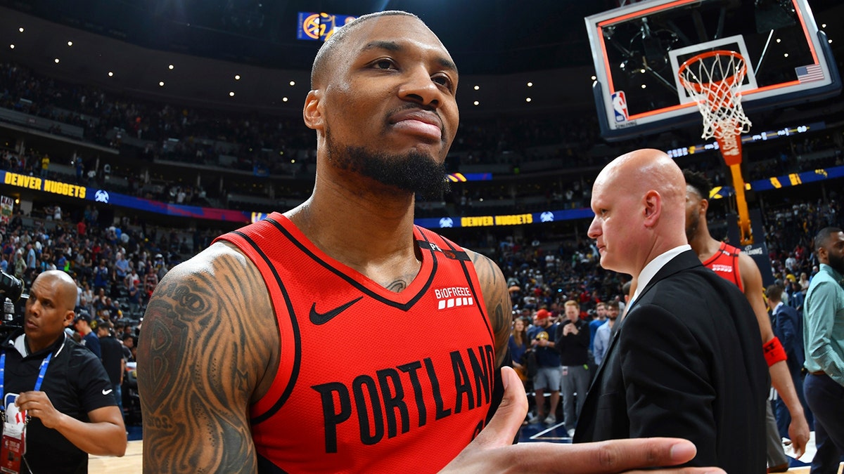 Portland Trail Blazers guard Damian Lillard celebrates after the second half of Game 7 of an NBA basketball second-round playoff series Sunday, May 12, 2019, in Denver. The Trail Blazers won 100-96. (AP Photo/John Leyba)