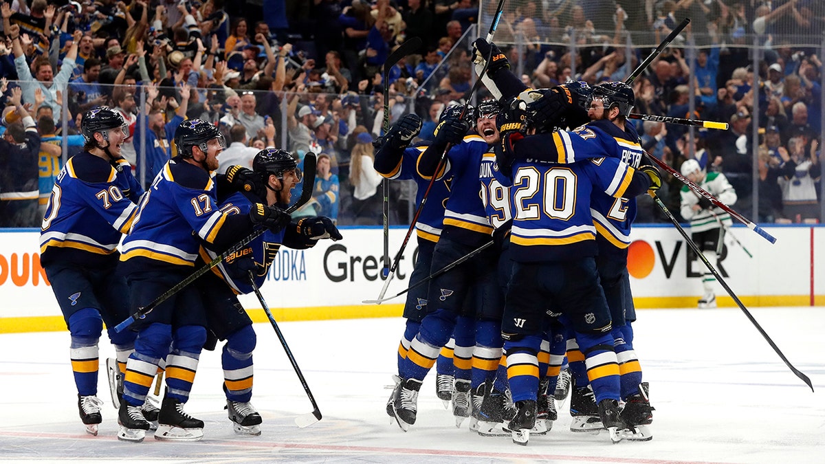 St. Louis Blues celebrate after defeating the Dallas Stars in double overtime in Game 7 of an NHL second-round hockey playoff series Tuesday, May 7, 2019, in St. Louis. The Blues won 2-1. (AP Photo/Jeff Roberson)