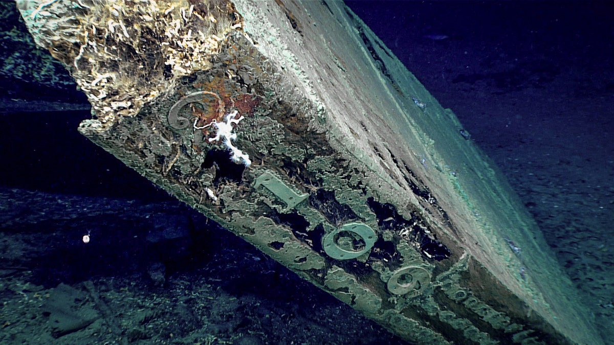 The numbers “2109” are visible on the trailing edge of the shipwreck's rudder.
