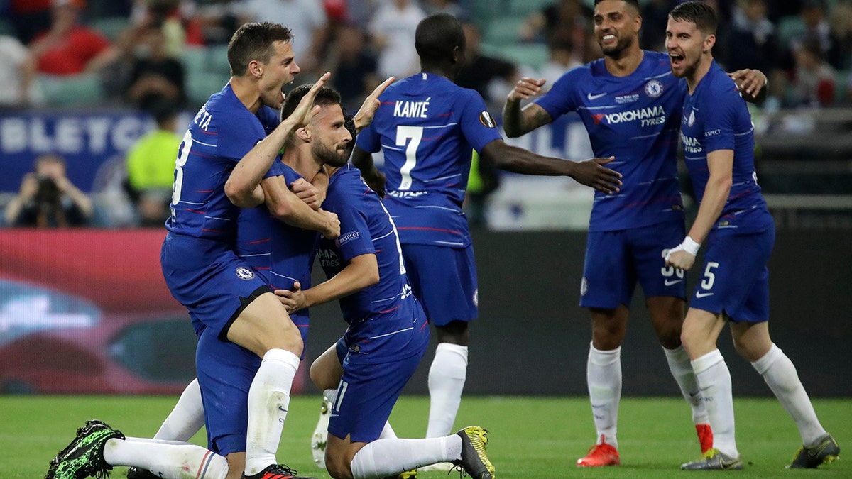 Chelsea's Olivier Giroud, second left, celebrates after scoring his side's opening goal during the Europa League Final soccer match between Arsenal and Chelsea at the Olympic stadium in Baku, Azerbaijan, Wednesday, May 29, 2019. (AP Photo/Luca Bruno)