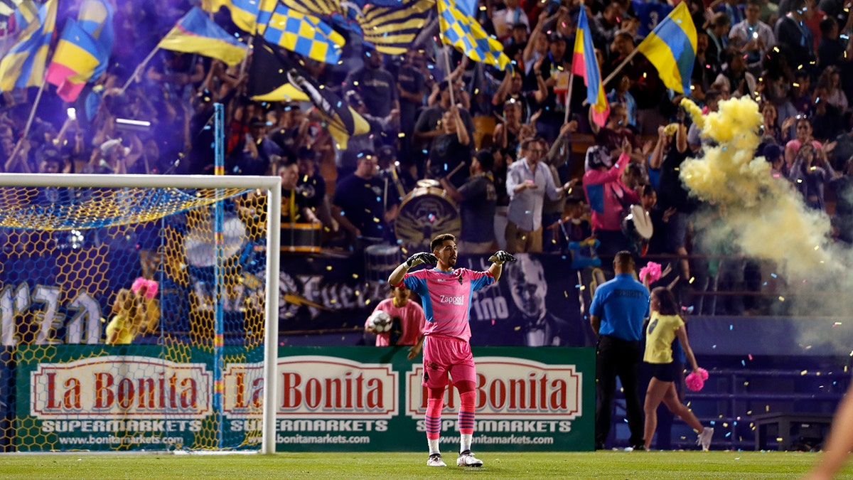 Las Vegas Lights FC fans celebrate the team's goal against the Tacoma Defiance in a soccer match at Cashman Field in Las Vegas. (Steve Marcus/Las Vegas Sun via AP)