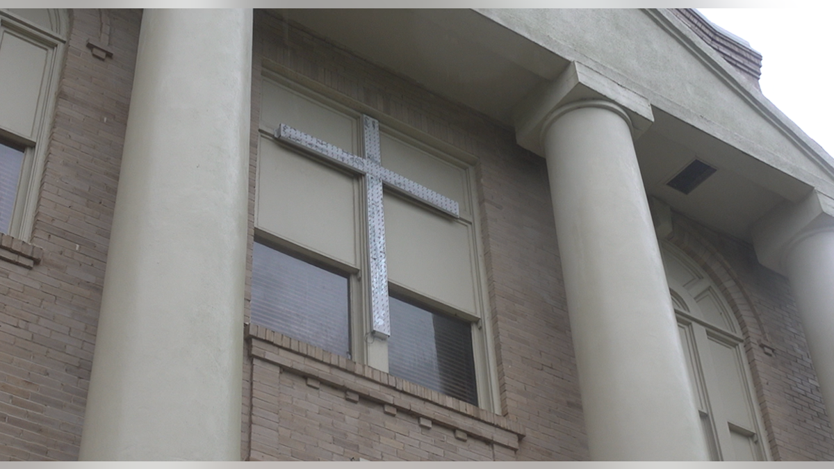 The crosses are displayed on the sides of the San Jacinto County Courthouse. They are lit up during the holiday season.