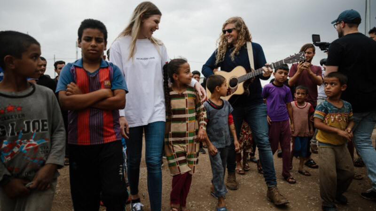 Bethel Music worship leaders Bethany Wohrle and Sean Feucht play music with refugees as part of the "Light A Candle Project."