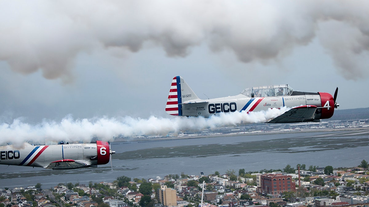 The Geico Skytypers fly a restored SNJ-2 plane -- also called a T-6 Texan by the Army Air Corps -- that originally was produced to train Allied pilots during World War II. Each plane is equipped with a system that can release streams of smoke to 'type' messages in the sky.