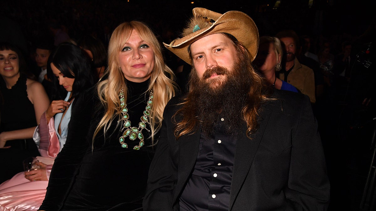 Chris Stapleton and his wife pose for a photo