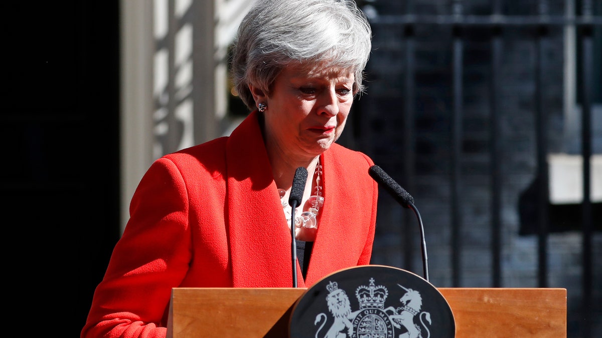 British Prime Minister Theresa May reacts as she turns away after making a speech in the street outside 10 Downing Street in London, England, Friday, May 24, 2019. Theresa May says she'll quit as UK Conservative leader on June 7, sparking contest for Britain's next prime minister.