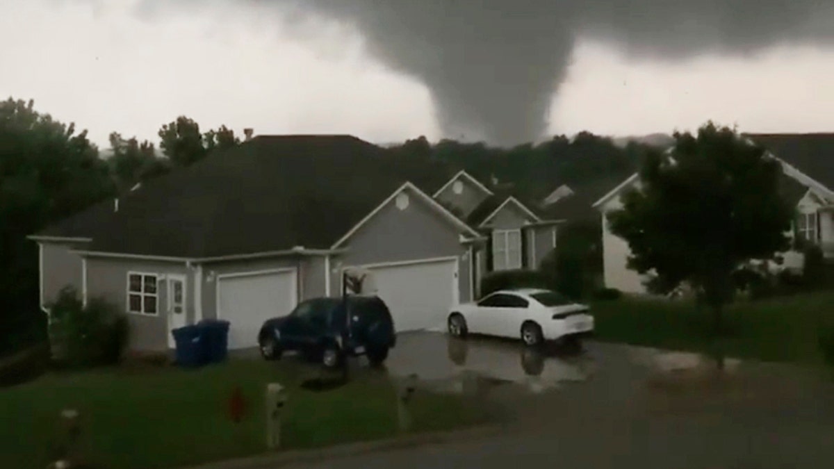 This still image taken from video provided by Chris Higgins shows a tornado in Carl Junction, Mo., on Wednesday, May 22, 2019. The tornado caused damage in the town about 4 miles north of the Joplin airport. (Chris Higgins via AP)