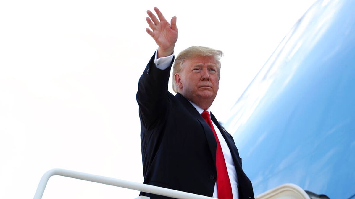 President Donald Trump boards Air Force One. (AP Photo/Andrew Harnik)