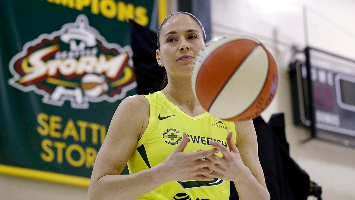 Seattle Storm's Sue Bird tosses a basketball as she waits to be photographed at the basketball team's media day Monday, May 13, 2019, in Seattle. The Storm is the defending WNBA champion. (AP Photo/Elaine Thompson)