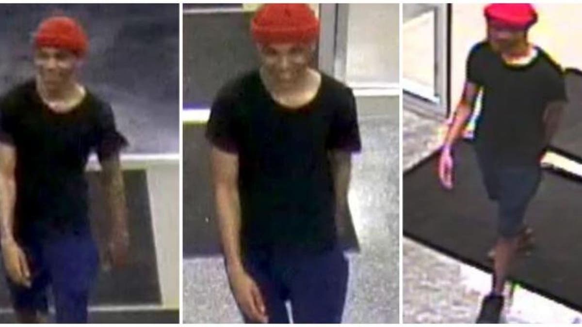 The suspect, later identified as Atkinson, appears to be between 5-foot-7 and 5-foot-10.