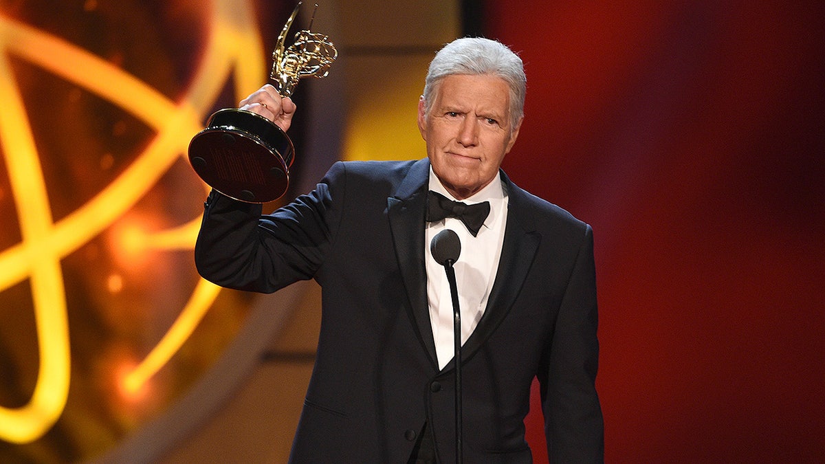Alex Trebek accepts the award for outstanding game show host for 