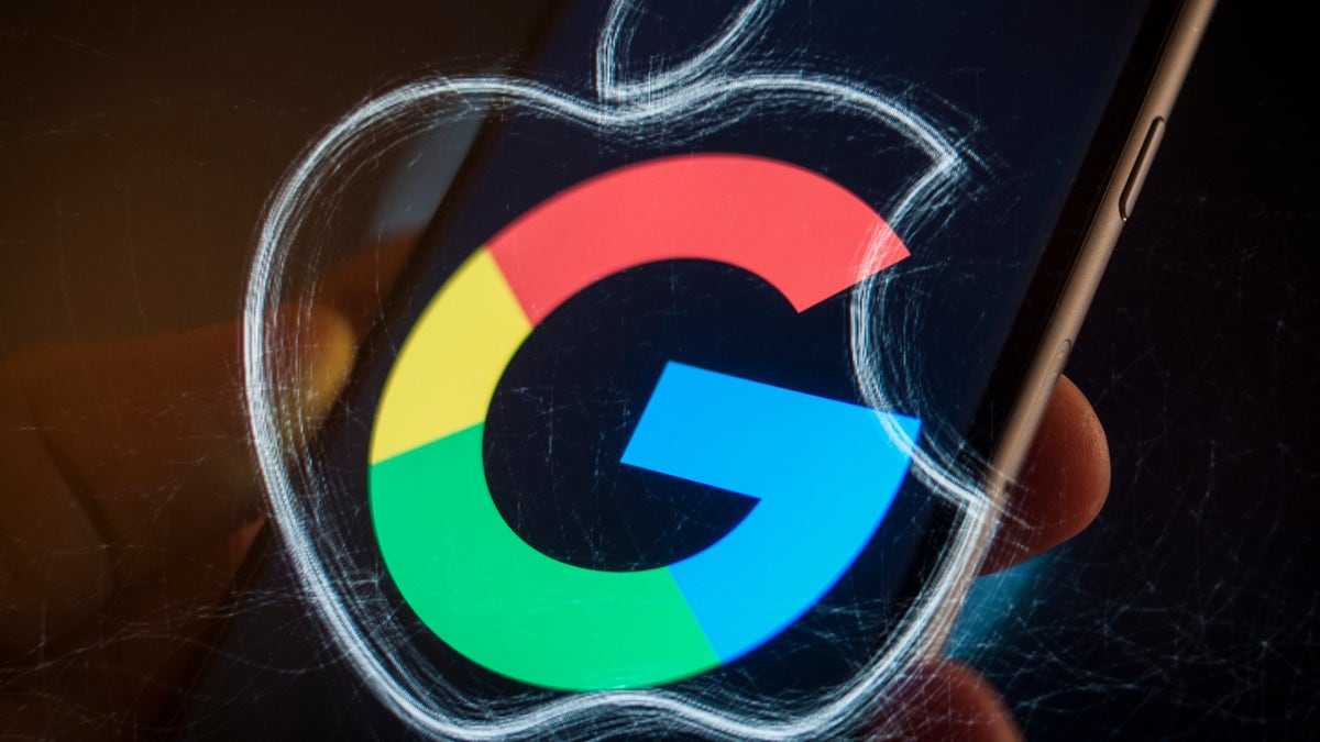 An Apple iPhone with a Google logo is seen in this photo illustration on December 6, 2017.