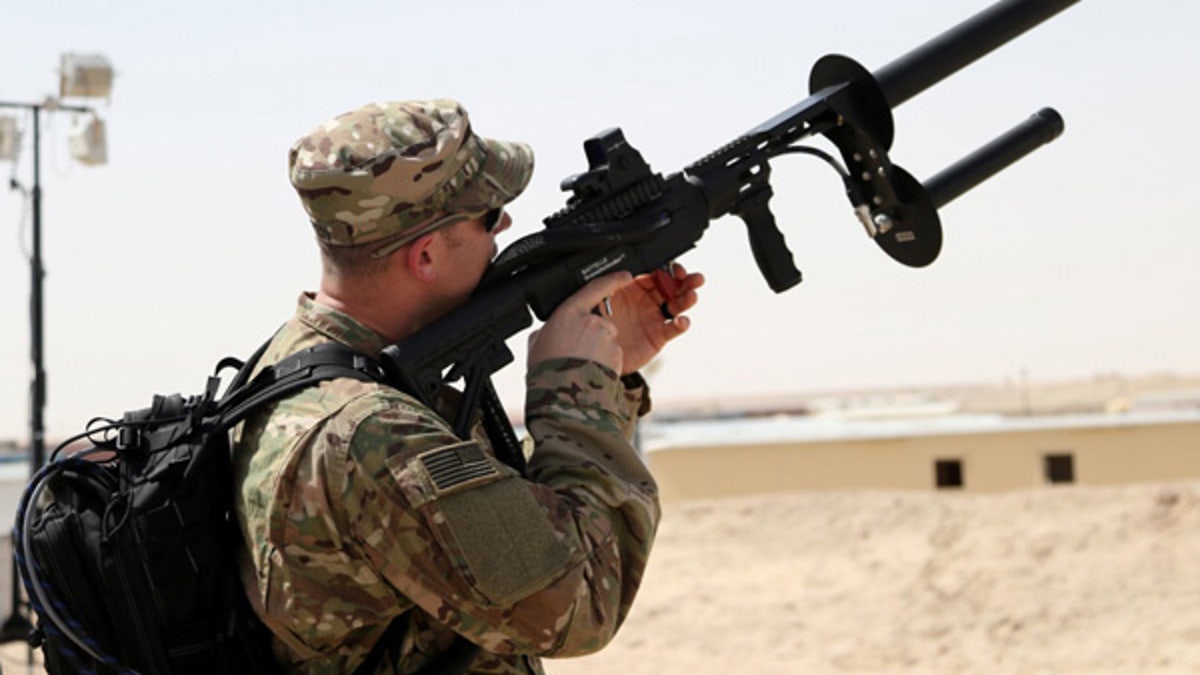 A soldier uses the Drone Defender to counter enemy drones. (Courtesy of U.S. Army)