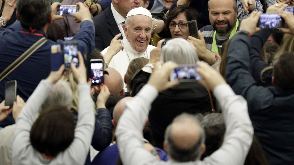 Pope Francis arrives for an audience with participants of a pilgrimage of the Italian-Albanian diocese of Lungro, in the Pope Paul VI hall, at the Vatican, Saturday, May 25, 2019.