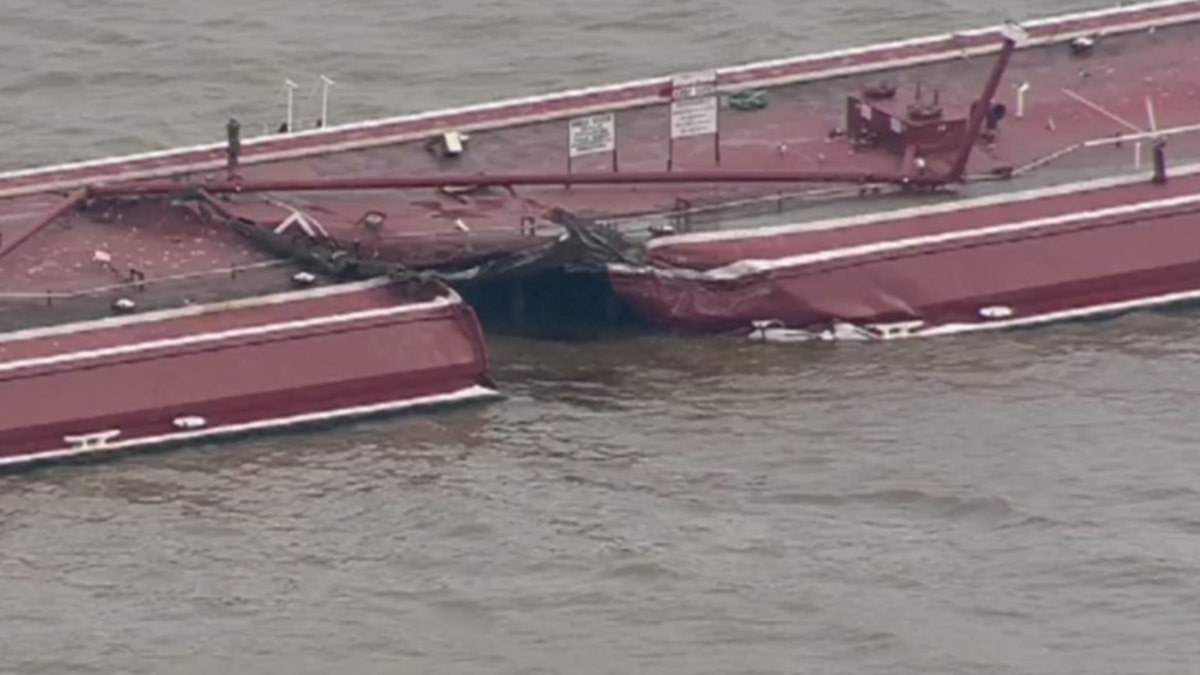 A tugboat carrying two barges collided with a 755-foot oil tanker in the Houston Ship Channel on Friday, causing one of the barges to sink and spilling chemicals used to make gasoline.