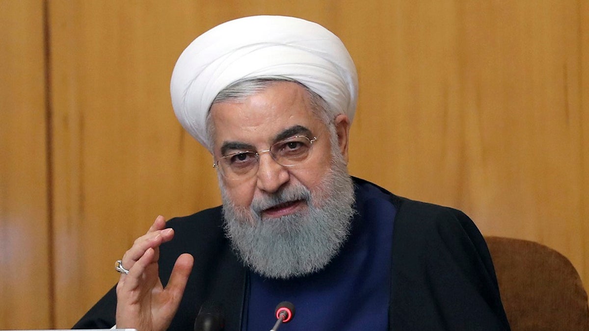 Iranian President Hassan Rouhani speaks in a cabinet meeting in Tehran, Iran, Wednesday, May 8, 2019. Rouhani said Wednesday that it will begin keeping its excess uranium and heavy water from its nuclear program, setting a 60-day deadline for new terms to its nuclear deal with world powers before it will resume higher uranium enrichment. (Iranian Presidency Office via AP)