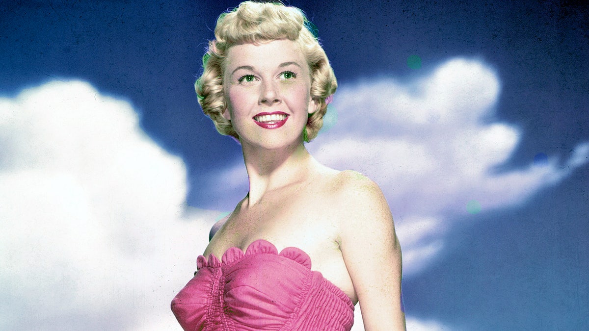 Doris Day, US actress and singer, wearing a pink swimsuit and holding a green swimming cap, circa 1955. (Photo by Silver Screen Collection/Getty Images)