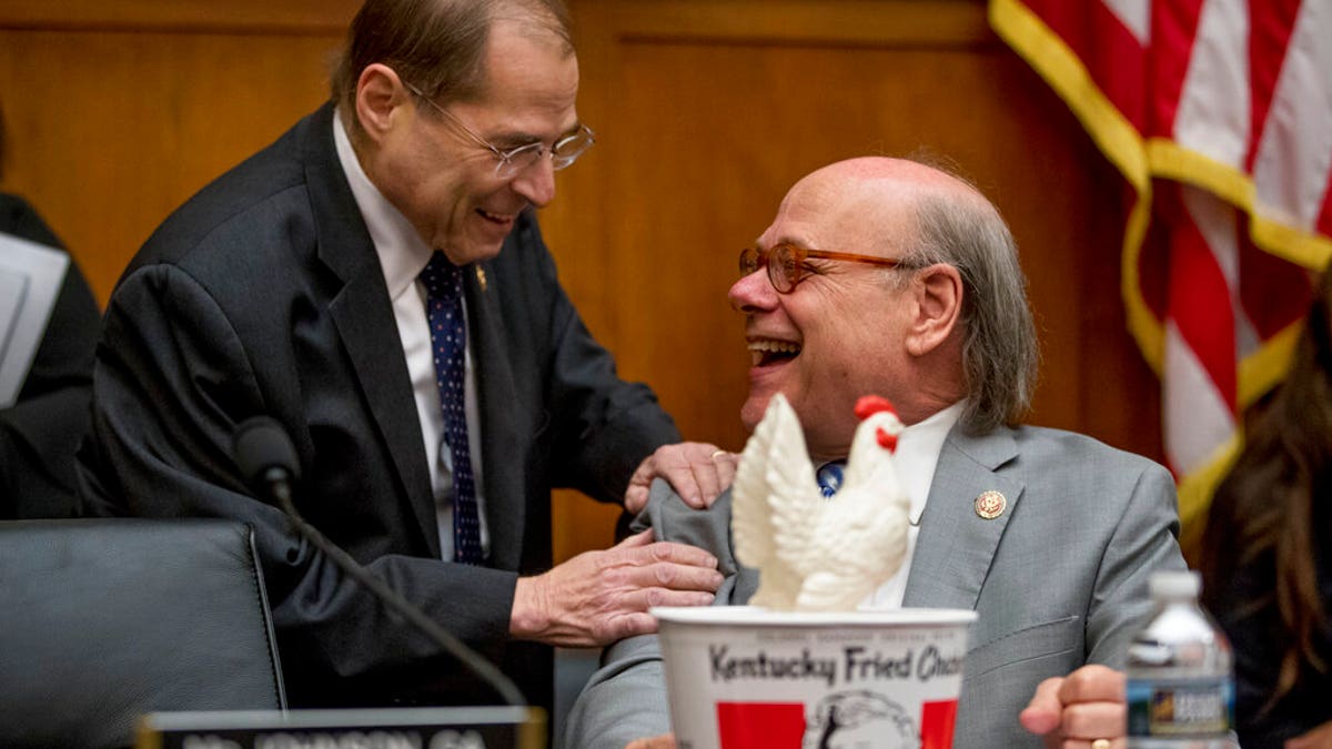 Judiciary Committee Chairman Jerrold Nadler, D-N.Y., left, laughs with Rep. Steve Cohen, D-Tenn., right, after Cohen arrived with a bucked of fried chicken and a prop chicken as Attorney General William Barr will not appear before a House Judiciary Committee hearing on Capitol Hill in Washington, Thursday, May 2, 2019. (AP Photo/Andrew Harnik)