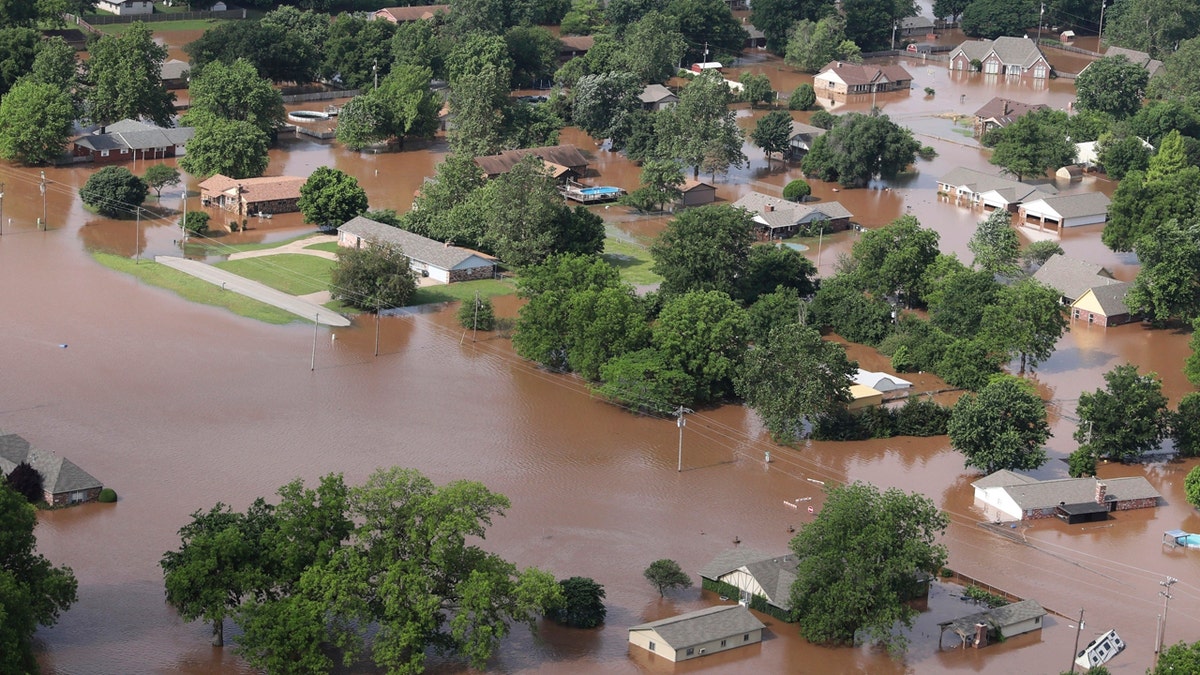 Homes are flooded near the Arkansas River in Tulsa, Okla., on Friday, May 24, 2019.