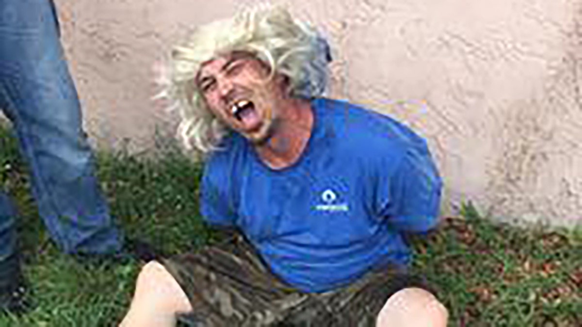 Robert “Bobby” Walls was arrested without incident after police saw through his "hideous wig" disguise, authorities said.