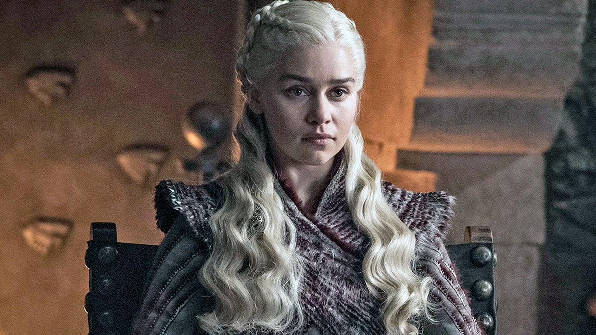This combination photo of images released by HBO shows Emilia Clarke portraying Daenerys Targaryen in 