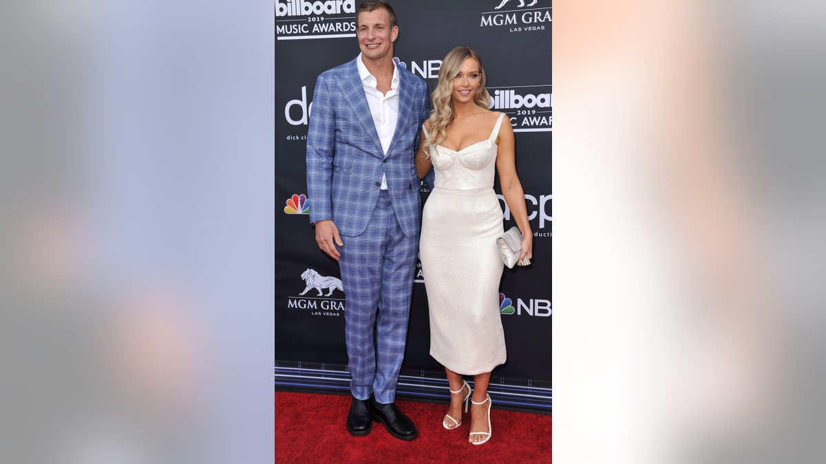 Rob Gronkowski, left, and Camille Kostek arrive at the Billboard Music Awards on Wednesday, May 1, 2019, at the MGM Grand Garden Arena in Las Vegas. (Photo by Richard Shotwell/Invision/AP)