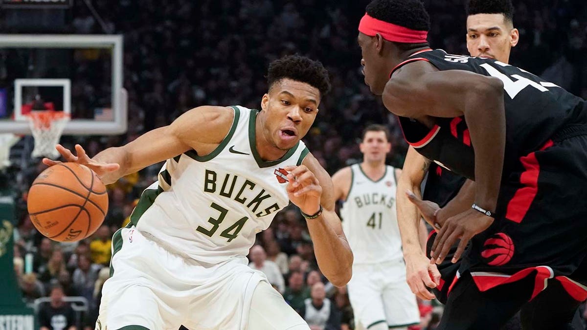 Milwaukee Bucks' Giannis Antetokounmpo tries to drive past Toronto Raptors' Pascal Siakam during the first half of Game 2 of the NBA Eastern Conference basketball playoff finals Friday, May 17, 2019, in Milwaukee.?