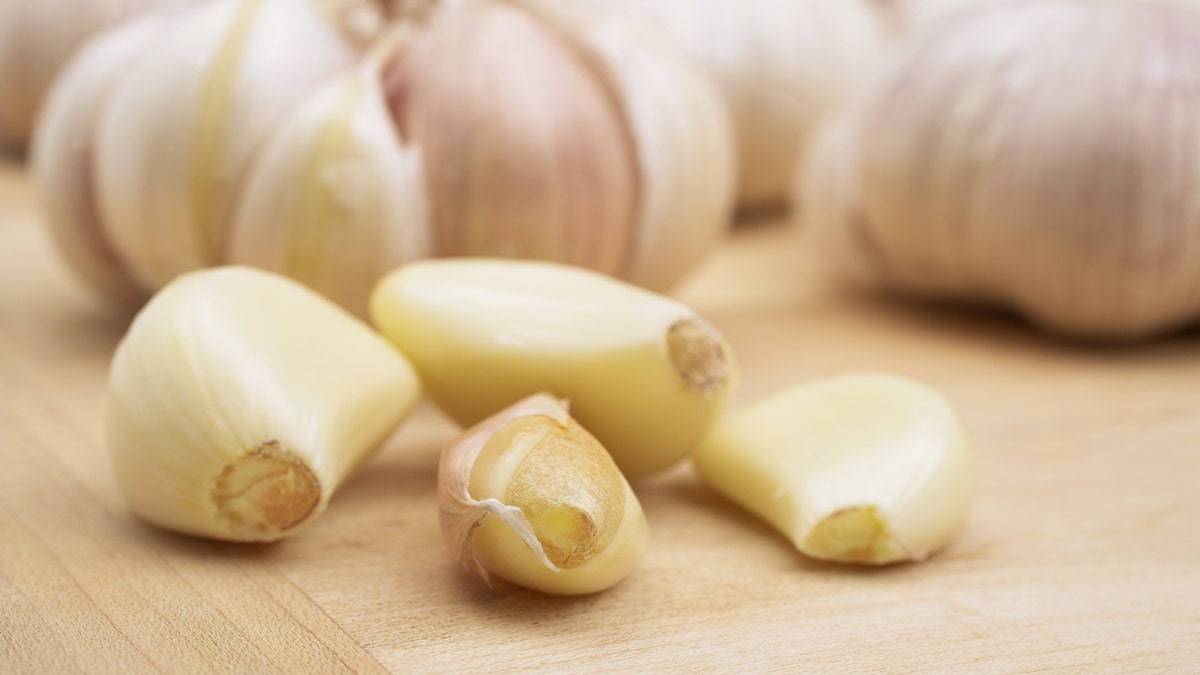 The water in the garlic steams and breaks down the bond between the clove and the skin for fast removal.