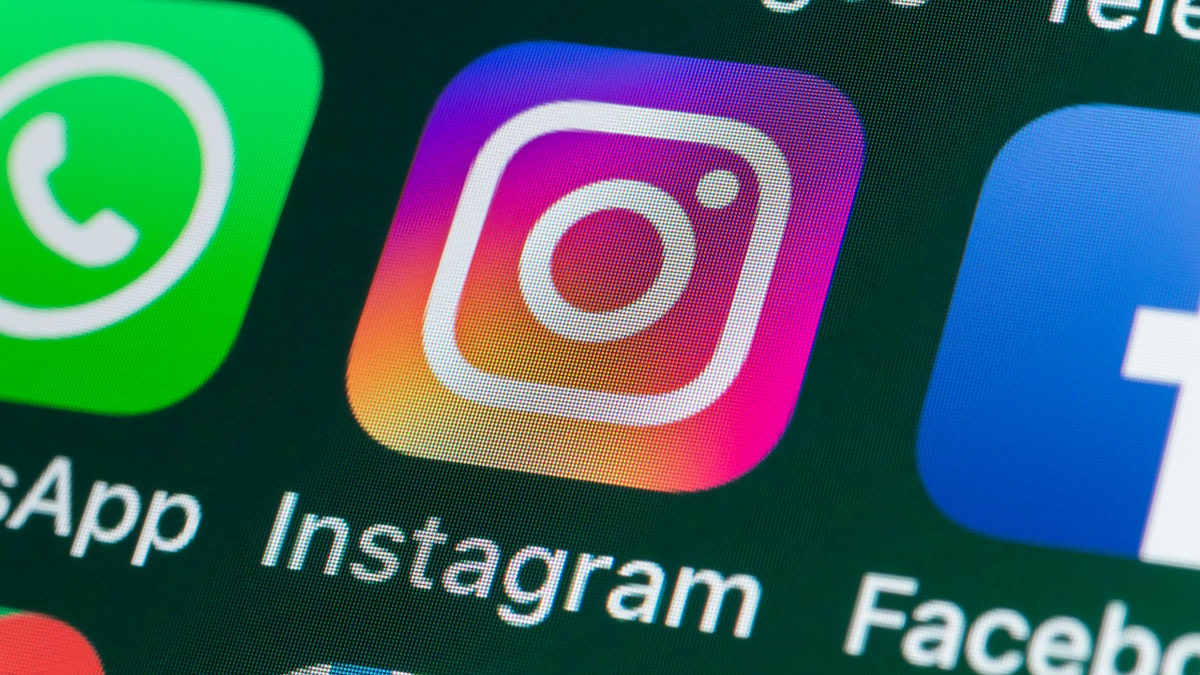The buttons of the photo app Instagram, surrounded by WhatsApp, Facebook, Messages and other apps on the screen of an iPhone. (iStock)