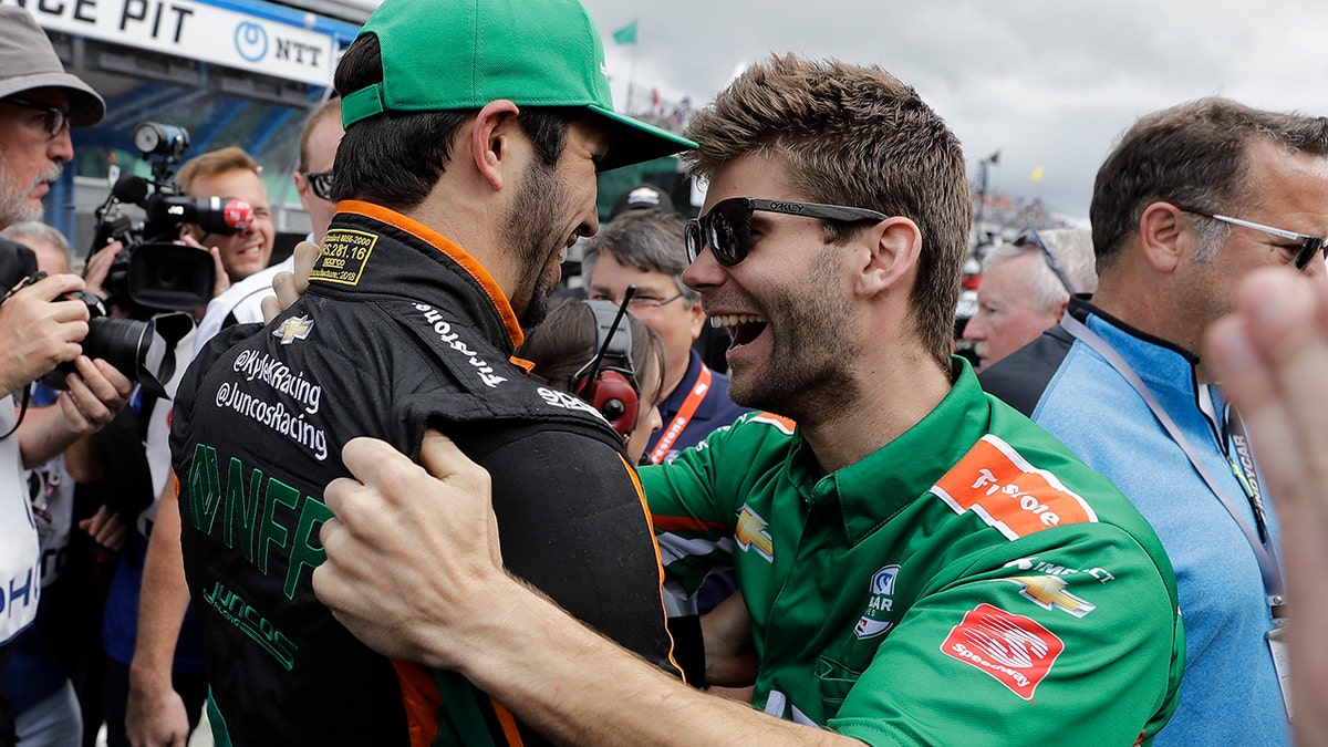 Kaiser (hat) celebrated with his team after qualifying for the race.