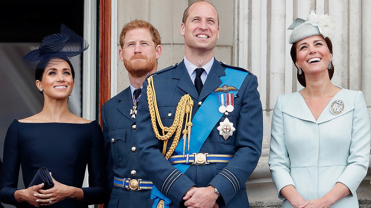 LONDON, UNITED KINGDOM - JULY 10: (EMBARGOED FOR PUBLICATION IN UK NEWSPAPERS UNTIL 24 HOURS AFTER CREATE DATE AND TIME) Meghan, Duchess of Sussex, Prince Harry, Duke of Sussex, Prince William, Duke of Cambridge and Catherine, Duchess of Cambridge watch a flypast to mark the centenary of the Royal Air Force from the balcony of Buckingham Palace on July 10, 2018 in London, England. The 100th birthday of the RAF, which was founded on on 1 April 1918, was marked with a centenary parade with the presentation of a new Queen's Colour and flypast of 100 aircraft over Buckingham Palace. (Photo by Max Mumby/Indigo/Getty Images)