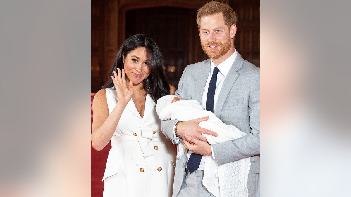 Britain's Prince Harry, Duke of Sussex (R), and his wife Meghan, Duchess of Sussex, pose for a photo with their newborn baby son in St George's Hall at Windsor Castle in Windsor, west of London on May 8, 2019. (Photo by Dominic Lipinski / POOL / AFP) (Photo credit should read DOMINIC LIPINSKI/AFP/Getty Images)