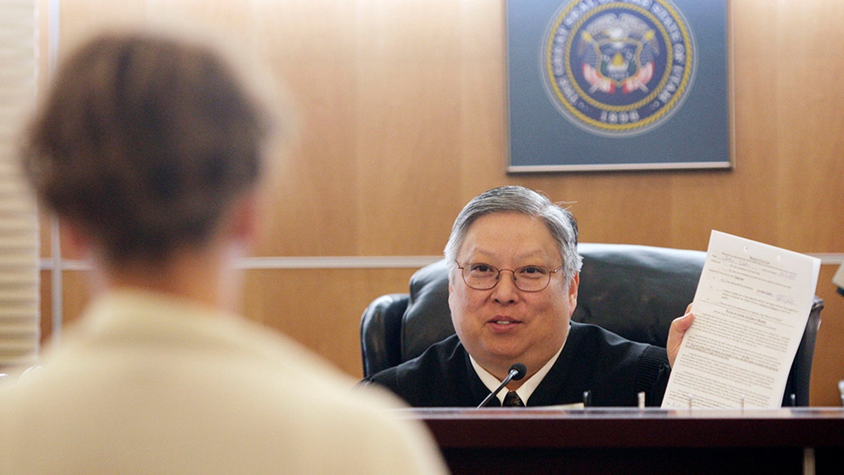 Taylorsville Judge Michael Kwan has been suspended without pay for six months for comments he made online and in court criticizing President Trump.