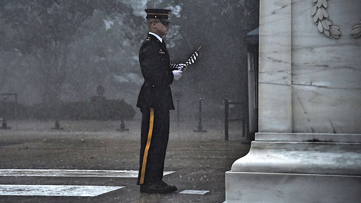 A severe thunderstorm Thursday failed to stop a sentinel from placing a flag at the Tomb of the Unknown Soldier.