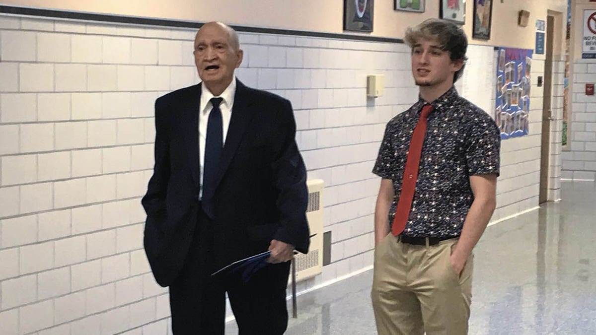 Pete Sabedra, 91, spending time with his grandson, Derry Area High School senior Kace Sabedra, after Pete received his honorary diploma from the school at Derry Area's annual awards ceremony in Derry, Pa. (Jeff Himler/Pittsburgh Tribune-Review via AP)