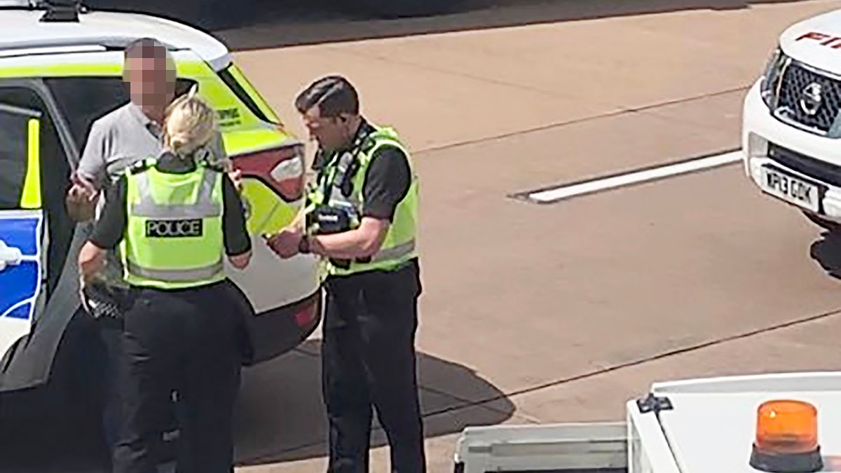 The passenger, who was escorted off the flight by police, was reportedly part of a larger group of rowdy fliers.