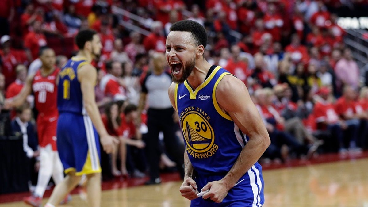 Golden State Warriors guard Stephen Curry (30) celebrates the team's win over Houston in Game 6 of a second-round NBA basketball playoff series, Friday, May 10, 2019, in Houston. Golden State won 118-113, winning the series. (AP Photo/Eric Gay)