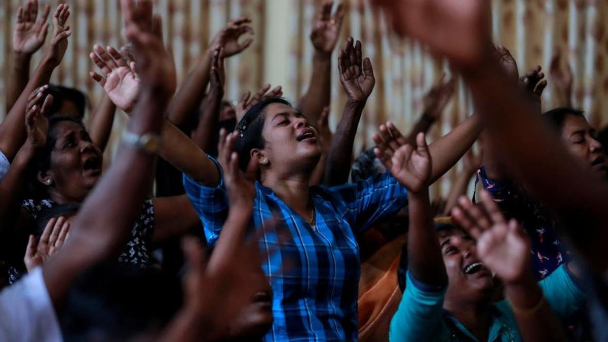 Zion Church members pray at a community hall in Batticaloa, Sri Lanka, May 5, 2019. Their church was bombed on Easter Sunday.