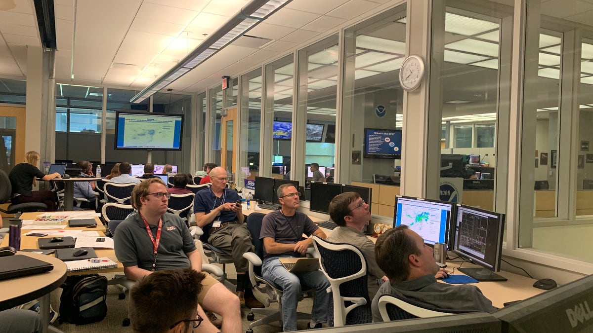 An expert team inside the National Weather Center "experimenting" in real-time with promising models to increase weather predictability