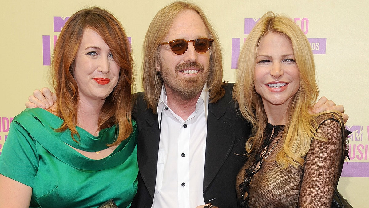 LOS ANGELES, CA - SEPTEMBER 06:  Musician Tom Petty (C), daughter Adria Petty and wife Dana Petty arrive at 2012 MTV Video Awards at Staples Center on September 6, 2012 in Los Angeles, California.  (Photo by Gregg DeGuire/WireImage)
