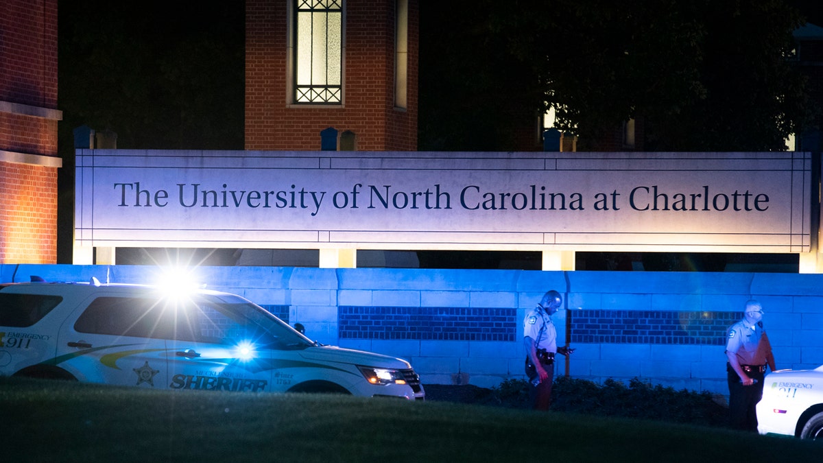 Police secure the main entrance to UNC Charlotte after a shooting at the school that left two students dead, Tuesday, April 30, 2019, in Charlotte, N.C.