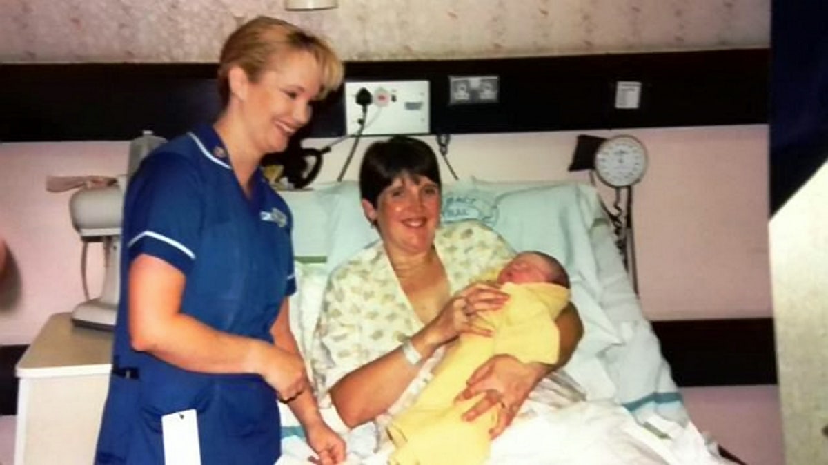 Midwife delivers baby