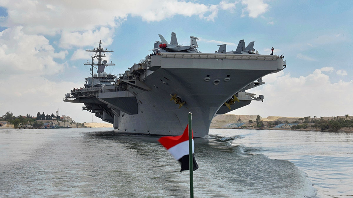 The USS Abraham Lincoln sails south in the Suez canal near Ismailia, Thursday, May 9, 2019.