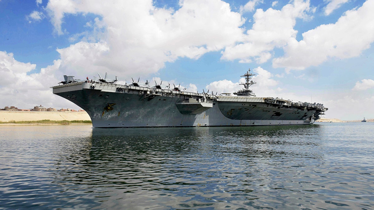 The USS Abraham Lincoln sails south in the Suez canal near Ismailia, Thursday, May 9, 2019.