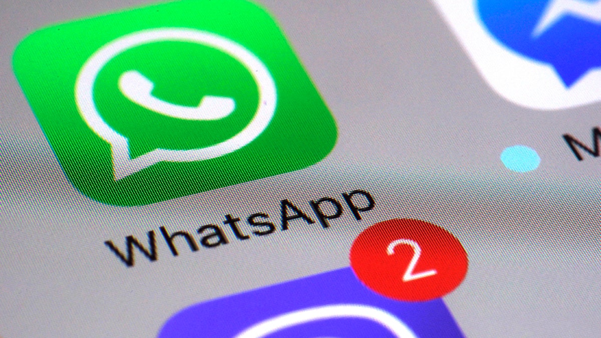 FILE - This Friday, March 10, 2017, file photo shows the WhatsApp communications app on a smartphone, in New York. WhatsApp says a vulnerability in the popular communications app let mobile phones be infected with sophisticated spyware with a missed in-app call alone. (AP Photo/Patrick Sison, File)